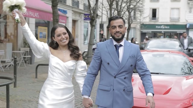 Couple beside a red car in a featured wedding film