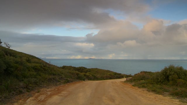 walk_to_the_beach_with_crashing_waves_downhill_from_coastal_hills_with_ocean_sounds 5