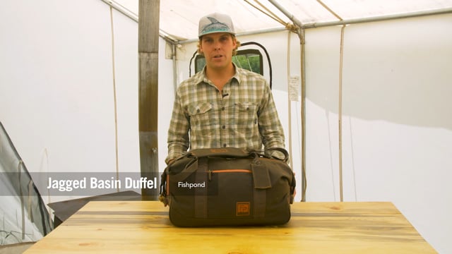 Fishpond Jagged Basin Duffel in waxed canvas—durable outdoor travel bag for adventure seekers.