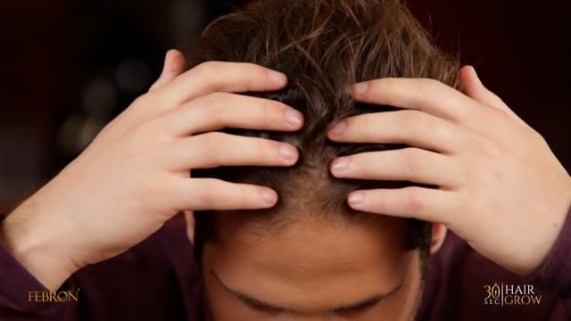 Man demonstrating use of Febron Hair Fibers to create fuller-looking hair for camera-ready appearance
