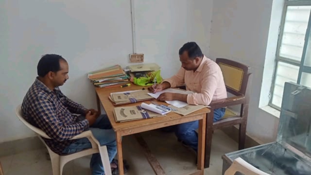 कैसरगंज इलाके में प्रधान पद के उपचुनाव के लिए नामांकन पत्र जांच करते सहायक निर्वाचन अधिकारी